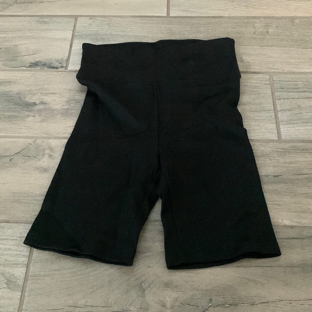 Twenty black bike shorts
